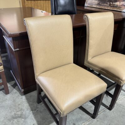 Tan Vinyl Armless Wooden Guest Chair